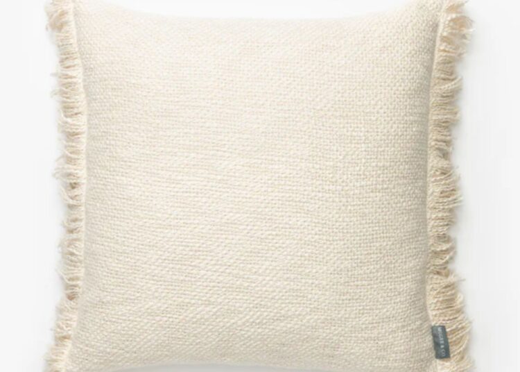 square cream cushion with tassel edge