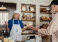 Marty DiBergi (Rob Reiner, R) finds Nigel Tufnel (Christopher Guest) in his cheese shop in "Spinal Tap II: The End Continues," in theaters Friday. Photo courtesy of Bleecker Street