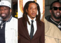50 Cent in a white jacket and cap, Jay-Z in a suit with dreadlocks, and Diddy in sunglasses and a tan jacket.