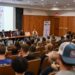 Panel discussion on careers in communication featuring various speakers at a university event, with an audience engaged in the session.