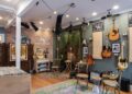 a room with guitars on the wall