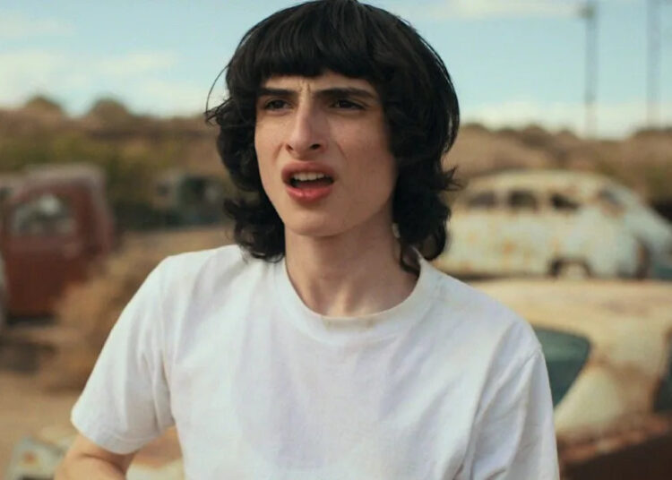 Finn Wolfhard as Mike in Stranger Things Season 4 looking shocked. .