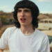 Finn Wolfhard as Mike in Stranger Things Season 4 looking shocked. .