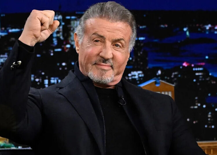 Sylvester Stallone raises his fist
