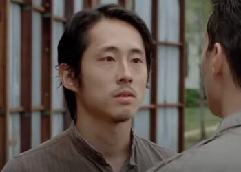 Glenn Rhee (Steven Yeun) has a conversation on The Walking Dead.