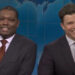 Michael Che and Colin Jost side by side during Weekend Update on SNL.