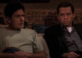 Charlie Harper (Charlie Sheen) and Alan Harper (Jon Cryer) talk in bed on Two and a Half Men.