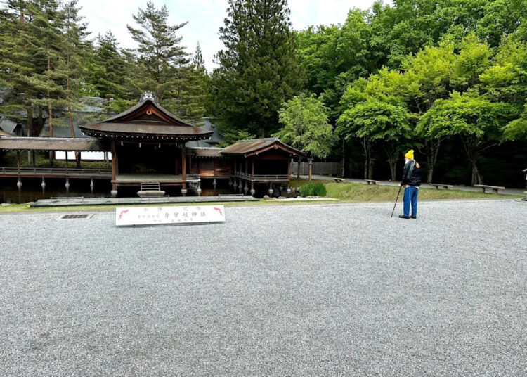 Terry Riley visiting a shrine and koi pond in Kobuchizawa, Japan.