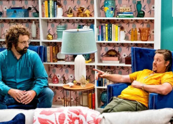 Eric Wareheim's Eric looks across at Tim Heidecker's Tim as they sit in a living room in Beef House