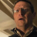 A shocked Tim Robinson in eyeglasses in The Chair Company