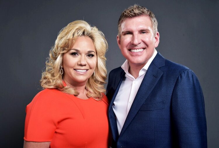 Julie and Todd Chrisley pose for a photo.