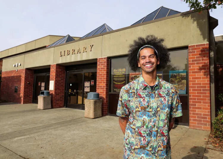 Mychal Threets rose to internet fame while he was working as a Bay Area librarian, and became known for his motivational social media posts about reading. (Yalonda M. James/San Francisco Chronicle)
