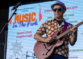 Man plays guitar at Music in the Park