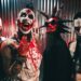 Members of Mudvanye look menacing. One of them is covered in blood, while the other is painted red and sports black and red spiked hair.
