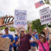 Demonstrators picket in response to the suspension of Jimmy Kimmel's late-night show outside of The Walt Disney Studios Thursday, Sept. 18, 2025, in Burbank, Calif.] - Jae C. Hong/AP
