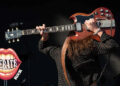 Greta Van Fleet's Jake Kiszka played a Gibson SG behind his head.