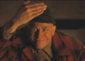 Charlie Hunnam makes a creepy face as Ed Gein in Monster: The Ed Gein Story