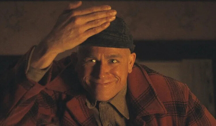 Charlie Hunnam makes a creepy face as Ed Gein in Monster: The Ed Gein Story