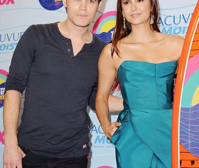 Paul Wesley and actress Nina Dobrev pose in the press room at the 2012 Teen Choice Awards
