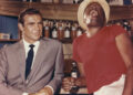 Sean Connery and John Kitzmiller on the set of <em>Dr. No</em>.