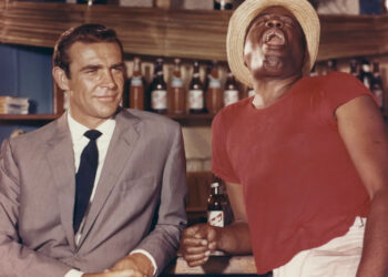 Sean Connery and John Kitzmiller on the set of <em>Dr. No</em>.