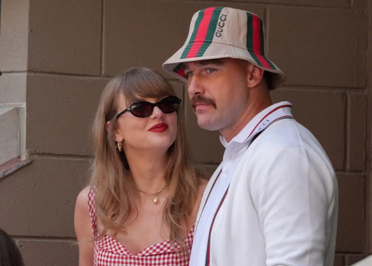TOPSHOT - US musician Taylor Swift (L) and US NFL football player Travis Kelce (R) attend the men's final match between Italy's Jannik Sinner and USA's Taylor Fritz on day fourteen of the US Open tennis tournament at the USTA Billie Jean King National Tennis Center in New York City, on September 8, 2024.