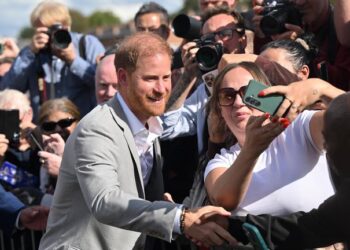 The Duke of Sussex greets people after visiting the Community Recording Studio in Nottingham. Pic: PA