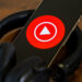 YouTube Music logo on smartphone with headphones