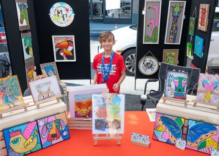young artist at a display