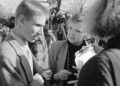 Archival image from the documentary Deaf President Now! featuring students and staff conferring about the protest at hand.