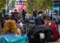Nine musicians performing on stage at The Home Rule Music Festival