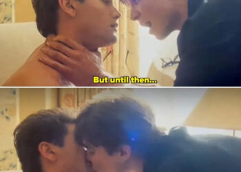 The two actors in the show kissing in their room, with the older brother grabbing the other's throat with a hand and pulling in closer