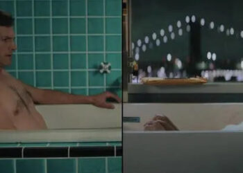 Two people in separate bathtubs look serious. The man is in a tiled bathroom, and the woman is in a modern setting, with lights visible behind her