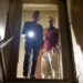 Claire and Luke peer down the stairs into the basement in The Innkeepers
