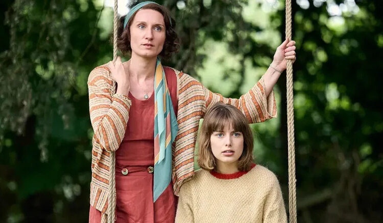 Nancy and Decca on a swing in Outrageous