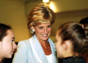 Diana, Princess of Wales, speaks with dancers at the studios of the English National Ballet August 2..