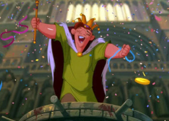 Quasimodo celebrates with a crown and staff in The Hunchback of Notre Dame