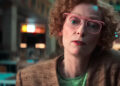 Tilda Swinton as Cynthia Blithe looks across frame in closeup in Ballad of a Small Player