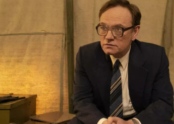 Jared Harris as Valery Legasov seated in a tent in Chernobyl