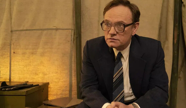 Jared Harris as Valery Legasov seated in a tent in Chernobyl