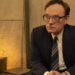 Jared Harris as Valery Legasov seated in a tent in Chernobyl