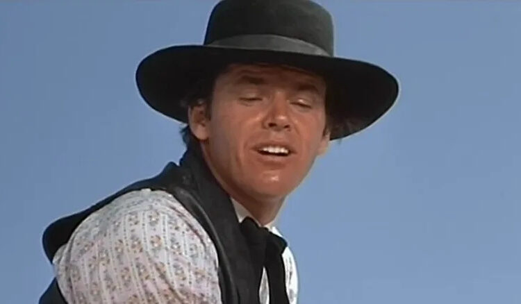 Jack Nicholson's Billy Spear is seen in closeup against a blue sky in The Shooting