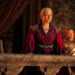 Rhaenyra watching in horror from a balcony dressed in royal robes on House of the Dragon