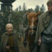 Peter Claffey as Ser Duncan and and Dexter Sol Ansell as Egg walking on a village road in A Knight of the Seven Kingdoms