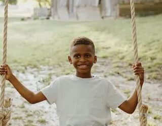 Kendall B Photography JT DeLay on a swing