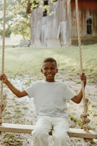 Kendall B Photography JT DeLay on a swing