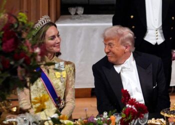 US President Donald Trump smiles at Britain's Catherine, Princess of Wales during a State Banquet at Windsor Castle, in Windsor, on September 17, 2025, during the US President's second State Visit. US President Donald Trump arrived in Britain for an unprecedented second State Visit, with the UK government rolling out a royal red carpet welcome to win over the mercurial leader. (Photo by Yui Mok / POOL / AFP)