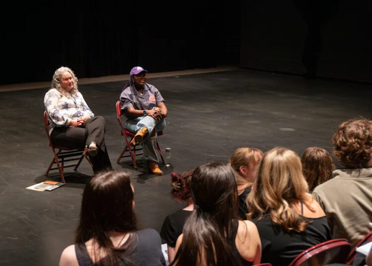 Candace Dickenson, Drama Department Voice Instructor, left, listens as alumni Danielle Brooks speaks to students September 25, 2025 in the full drama studio at The South Carolina Governor's School for the Arts & Humanities is a prestigious boarding school for the arts located in Greenville, South Carolina.