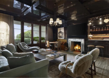 Cozy living space with a fireplace and bar area.