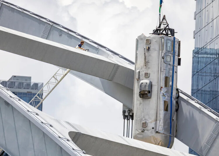 A scene for the ABC show Nashville 911 involving an Airstream trailer stuck on the top of a bridge due to a tornado is filmed on the Korean Veterans Bridge Sunday, July 13, 2025